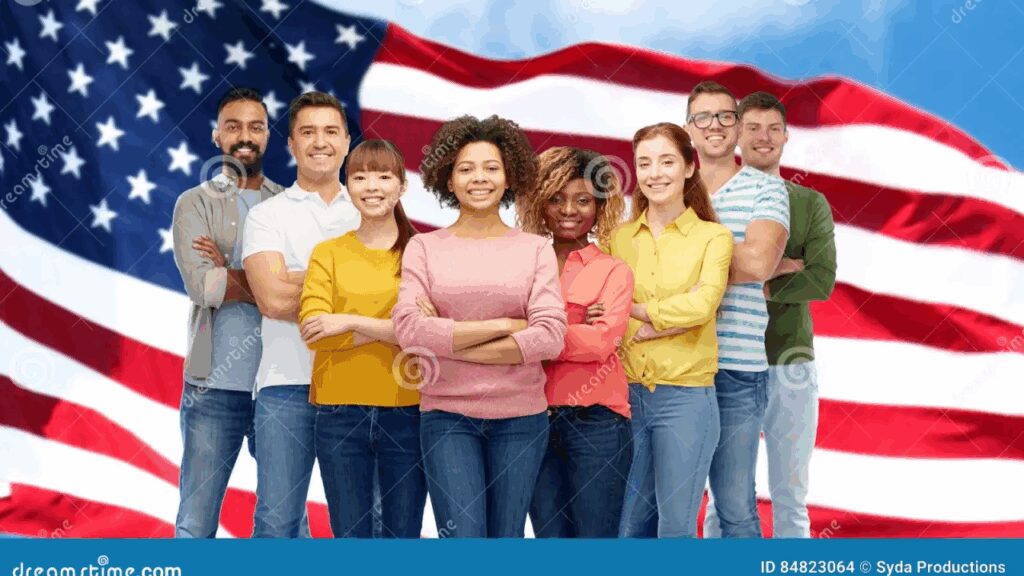 Diverse group of smiling people standing united with an American flag in the background.